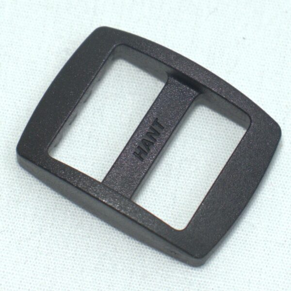 Plastic buckle for adjusting length of webbing or strap. Also known as an adjuster or square buckle or SB