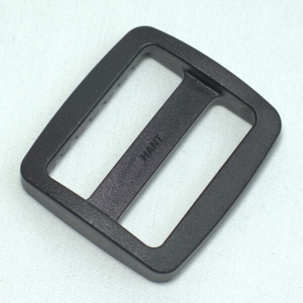 Plastic buckle for adjusting length of webbing or strap. Also known as an adjuster or square buckle or SB