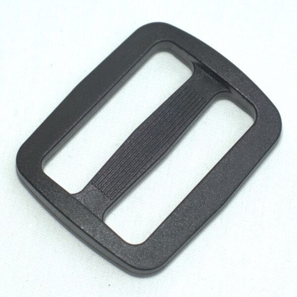 Plastic buckle for adjusting length of webbing or strap. Also known as an adjuster or square buckle or SB