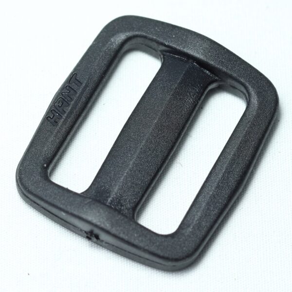 Plastic buckle for adjusting length of webbing or strap. Also known as an adjuster or square buckle or SB