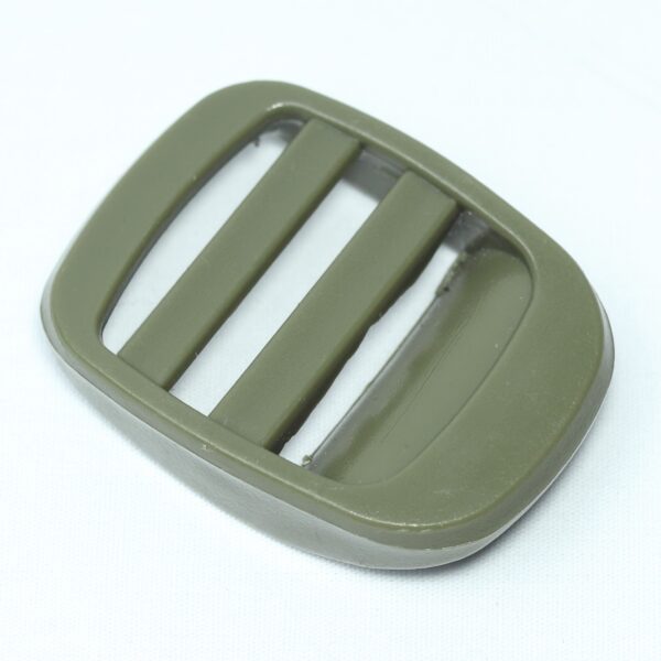 bulky looking Plastic ladder lock buckle used for adjusting webbing of a backpack or other equipment