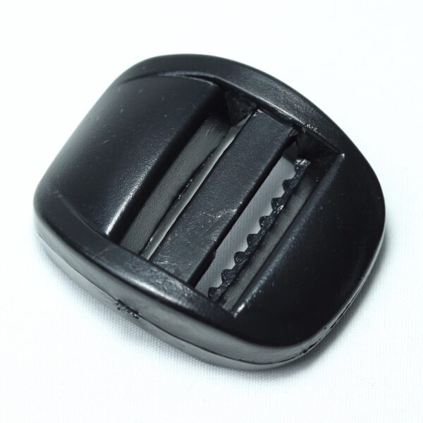 bulky looking Plastic ladder lock buckle used for adjusting webbing of a backpack or other equipment