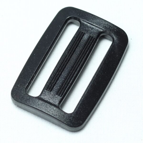 Plastic buckle for adjusting length of webbing or strap. Also known as an adjuster or square buckle or SB