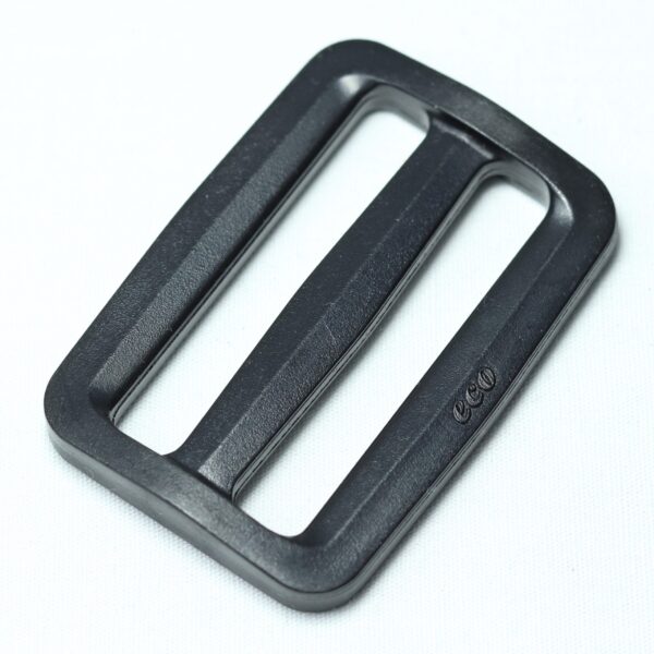 Plastic buckle for adjusting length of webbing or strap. Also known as an adjuster or square buckle or SB